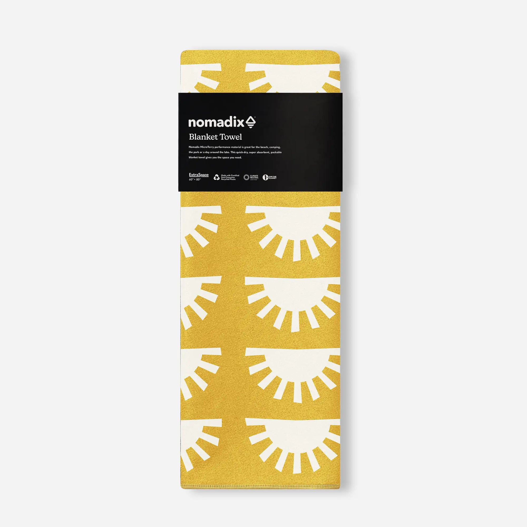 Golden yellow blanket towel with white sunburst pattern shown in product packaging
