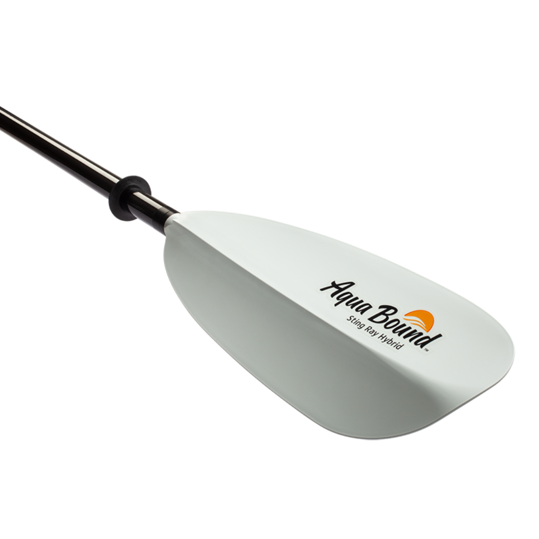 Two-piece kayak paddle with white blade and black carbon fiber shaft at angle