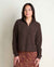 Women's cropped quarter-zip fleece pullover in dark brown, front view on model