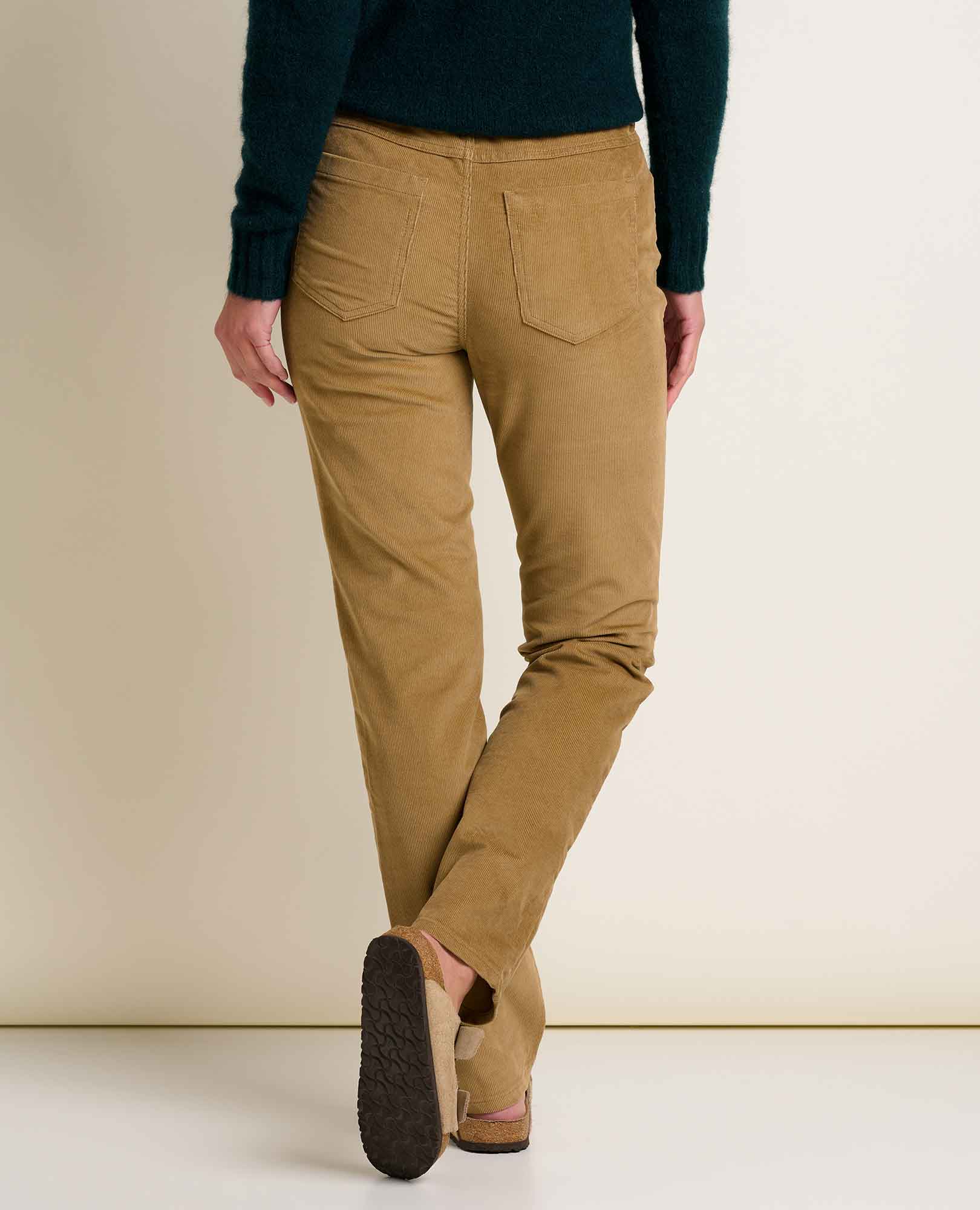 Women's slim-fit corduroy pants in warm tan, back view with two rear pockets