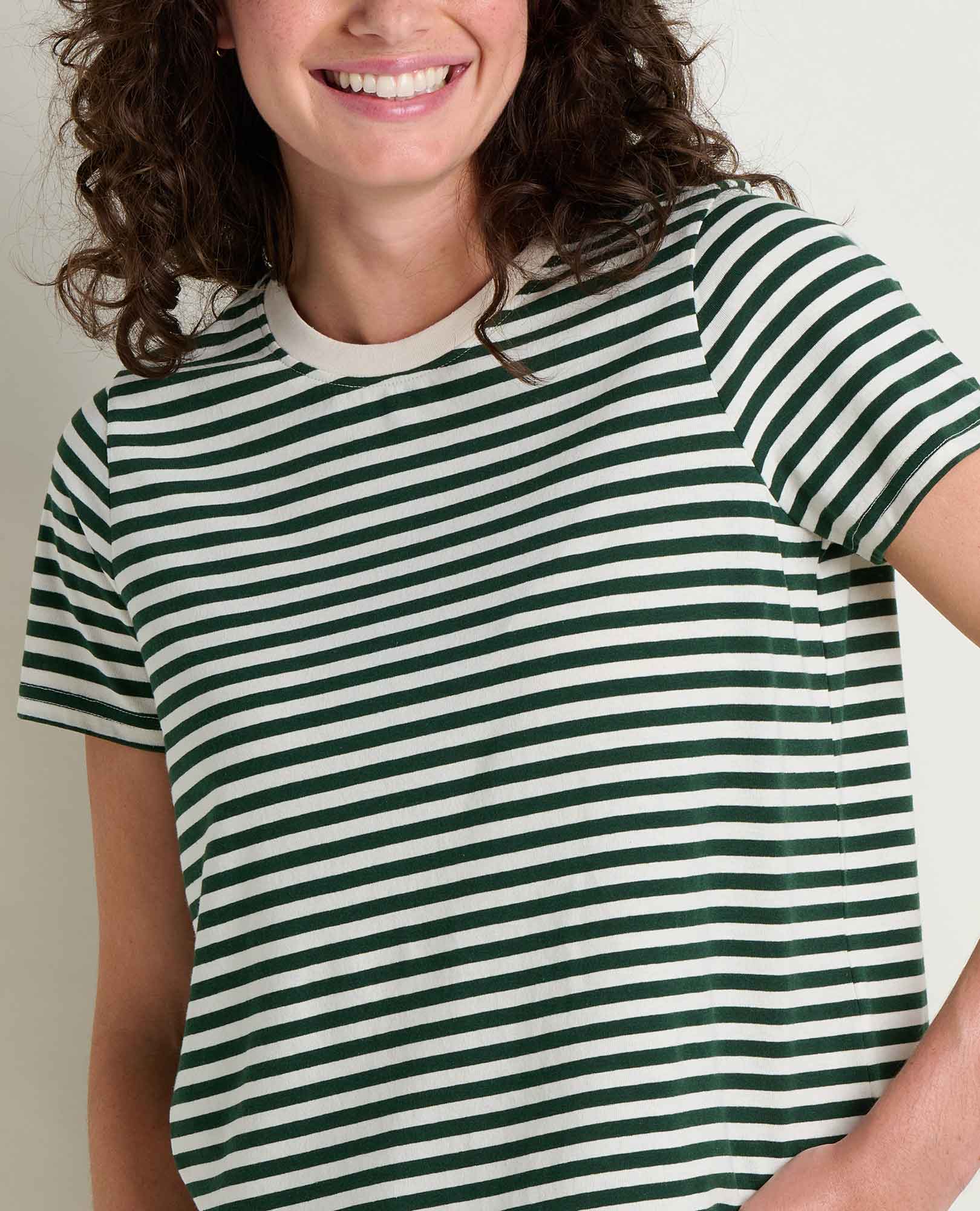 Green and white striped short-sleeve crew neck t-shirt on smiling woman