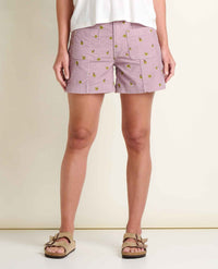 Light purple corduroy shorts with yellow floral embroidery pattern, front view on model