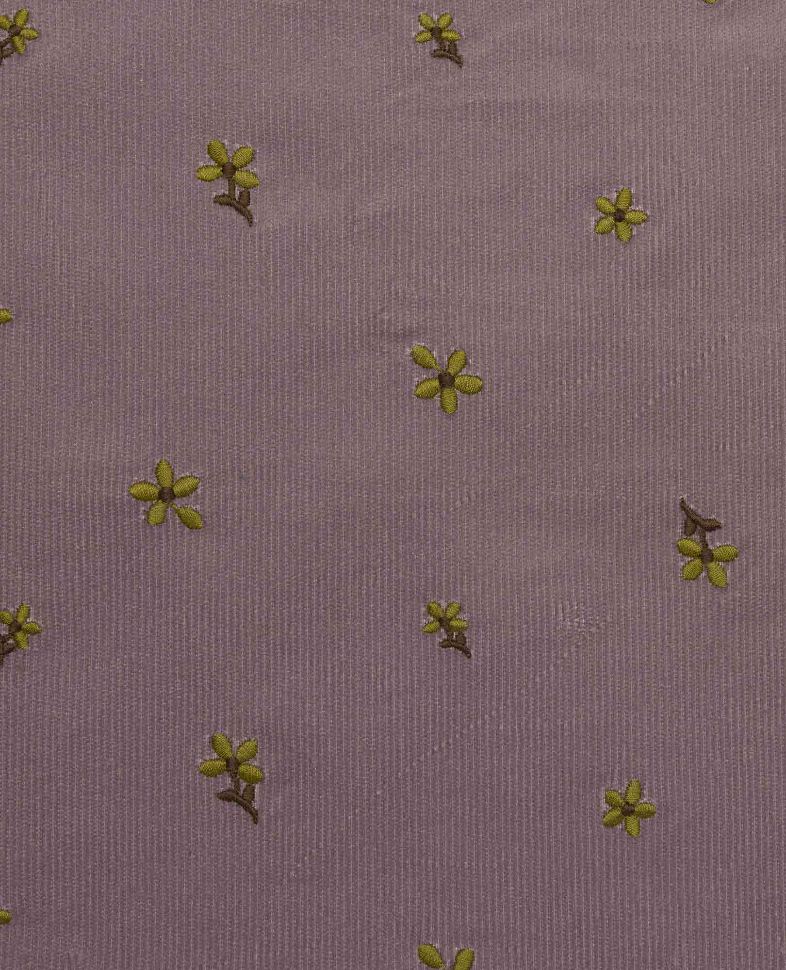 Purple corduroy fabric with small yellow embroidered flowers scattered across surface