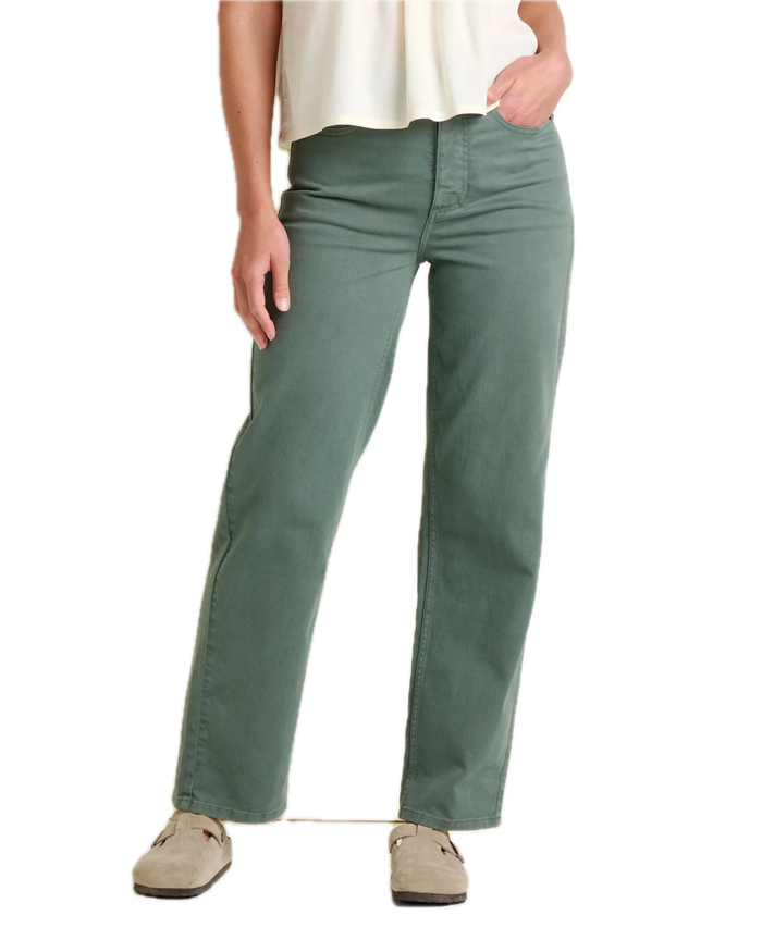 Sage green straight leg pants worn with cream top and tan shoes, front view