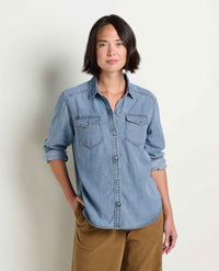Women's light wash denim button-up shirt with dual chest pockets, long sleeves, front view