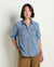 Women's light wash denim button-up shirt with dual chest pockets, long sleeves, front view