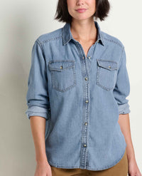 Women's light wash denim button-up shirt with dual chest pockets and rolled sleeves, front view