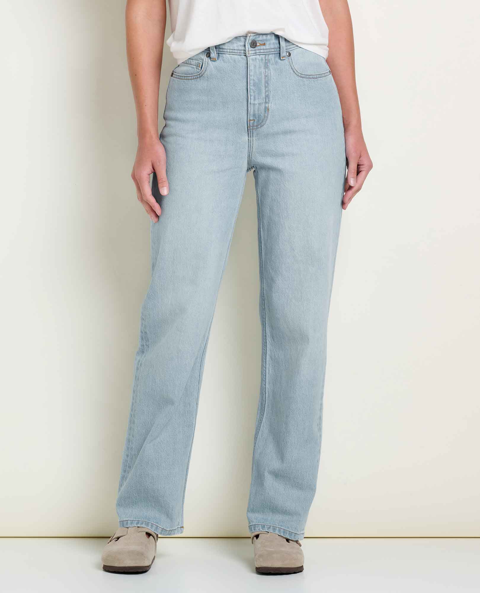 Women's high-rise straight leg light wash jeans, front view on model