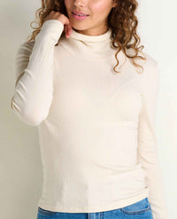 Women's ribbed turtleneck long-sleeve top in cream, close-up front view on model