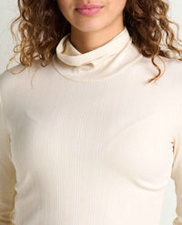 Close-up of ribbed turtleneck long-sleeve top in cream, shown on model from chest up