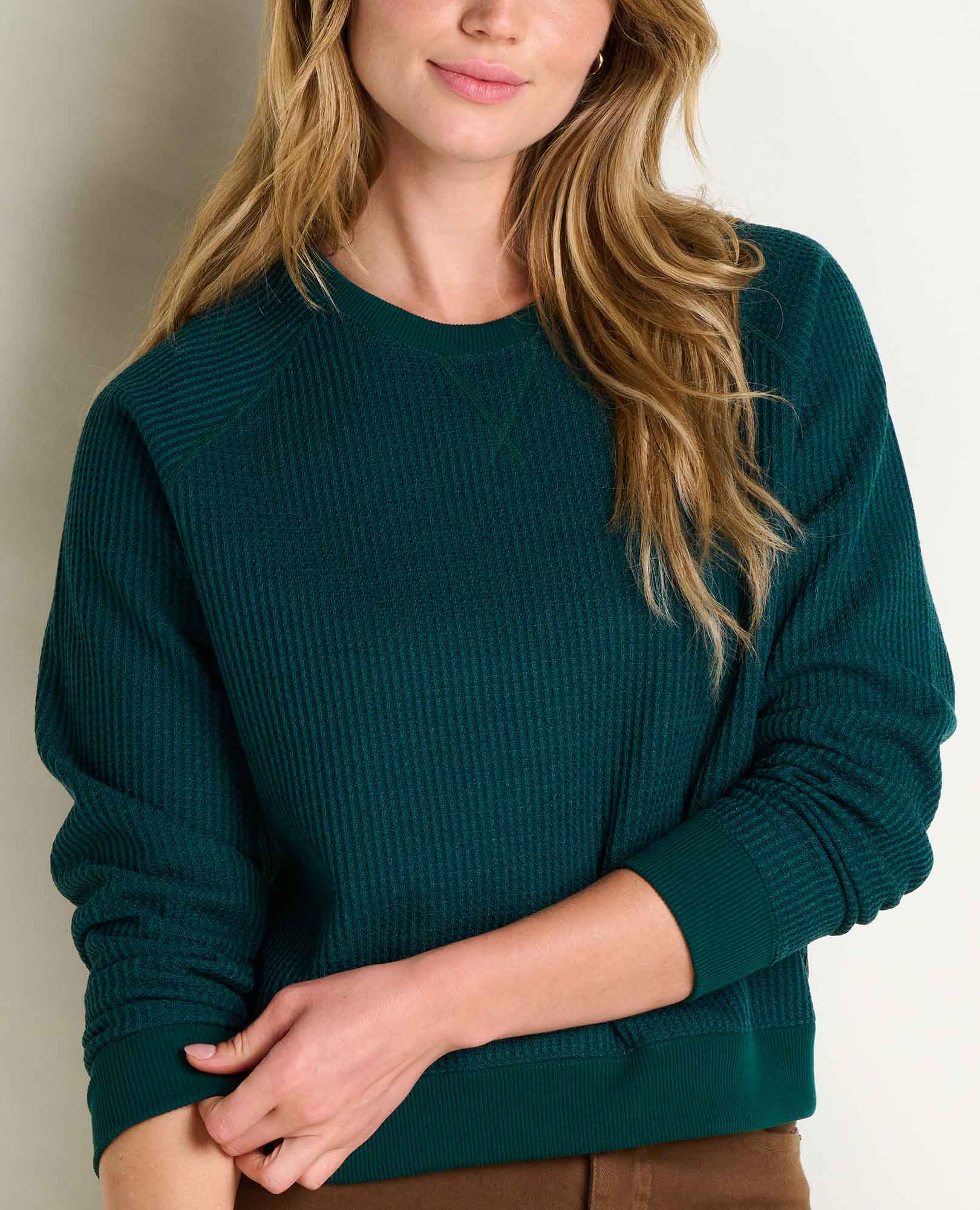 Women's ribbed long-sleeve pullover sweatshirt in deep teal, front close-up view