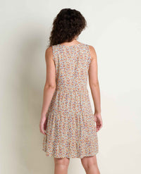 Sleeveless tiered dress with small floral print, shown from back view