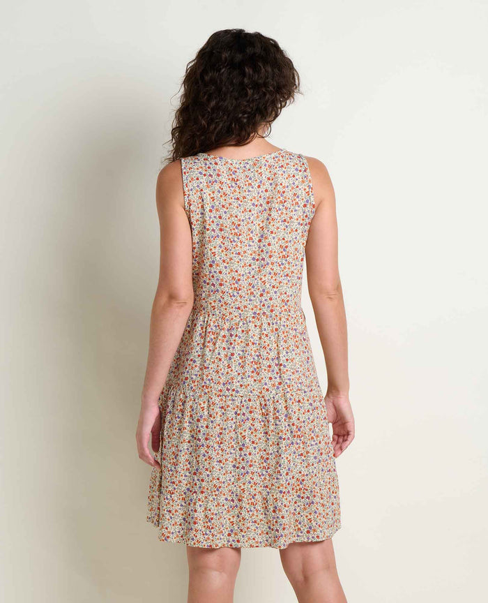 Sleeveless tiered dress with small floral print, shown from back view