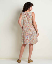 Sleeveless tiered dress with small floral print shown from back view on model