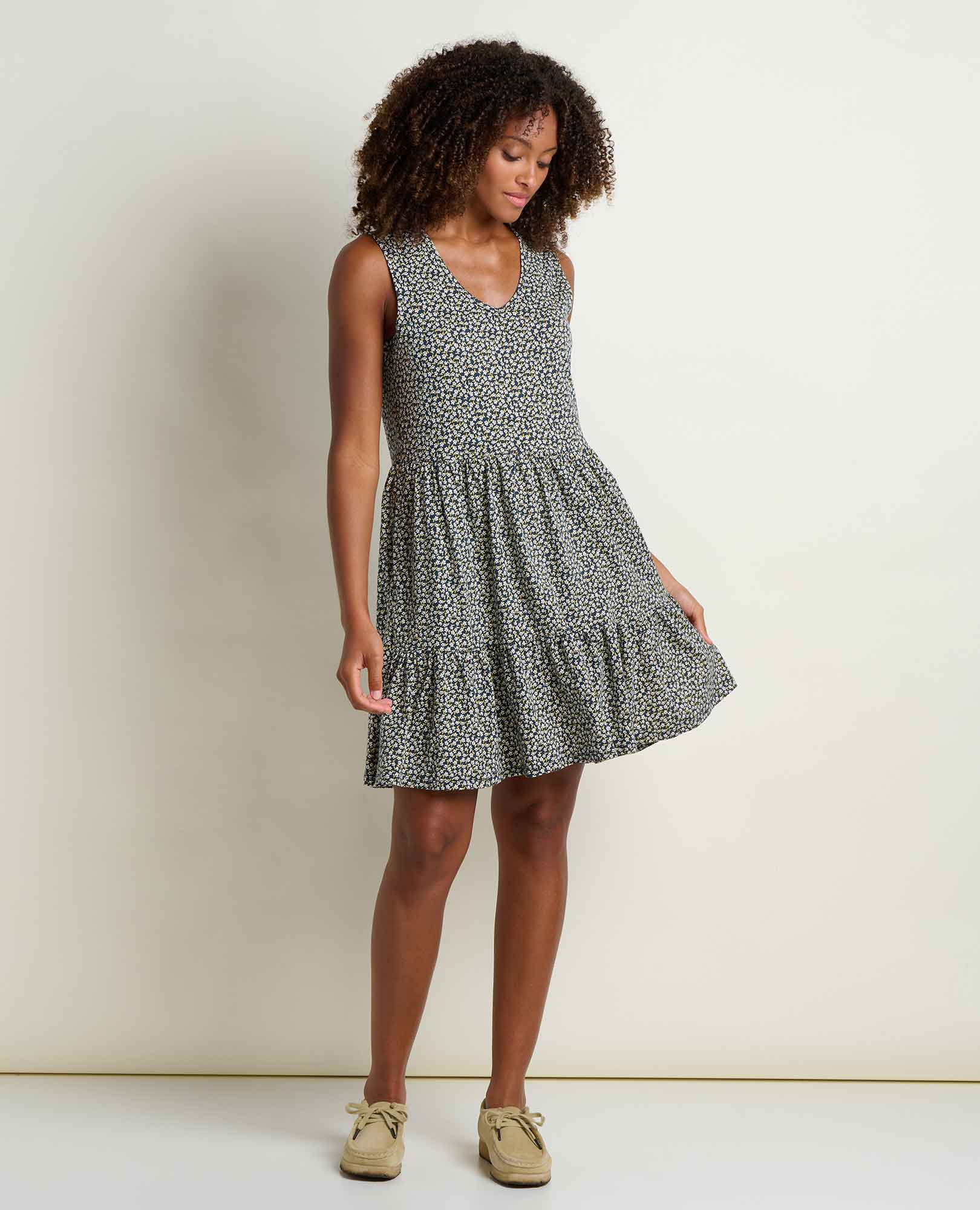 Sleeveless tiered tank dress with small floral print, V-neck, worn by model