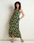Sleeveless maxi dress with yellow floral print on dark background, asymmetrical hem