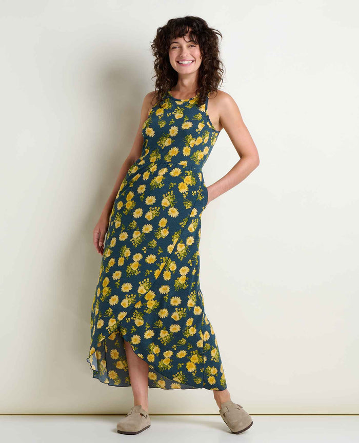 Sleeveless maxi dress with yellow floral print on dark background, asymmetrical hem