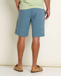 Men's chino shorts in dusty blue, back view showing fit and styling with boat shoes