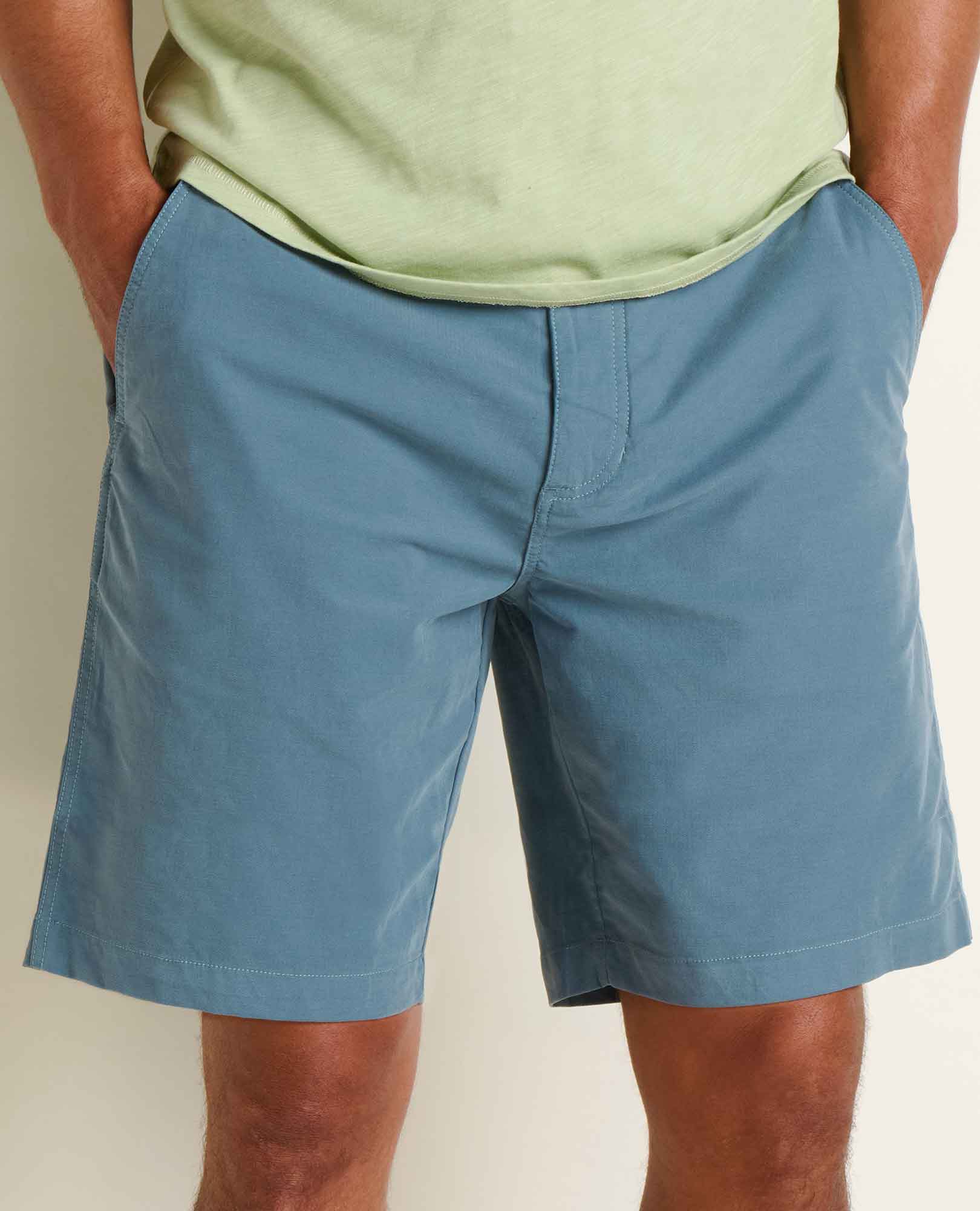 Blue-gray chino shorts on model, front view showing fit and styling