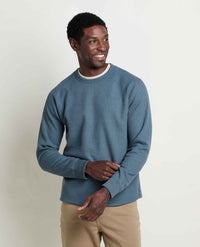 Men's long-sleeve waffle-knit crew neck pullover in muted teal, front view on model