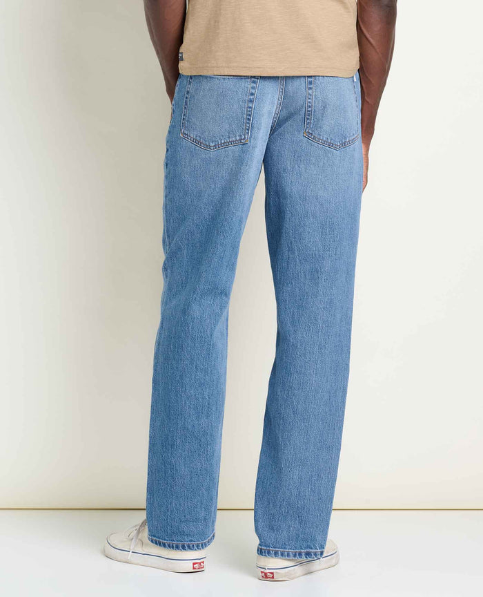 Men's straight leg blue jeans, back view, showing two rear pockets and relaxed fit