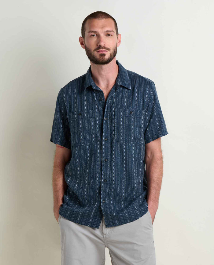Navy blue short sleeve button-up shirt with vertical striped pattern, front view on model