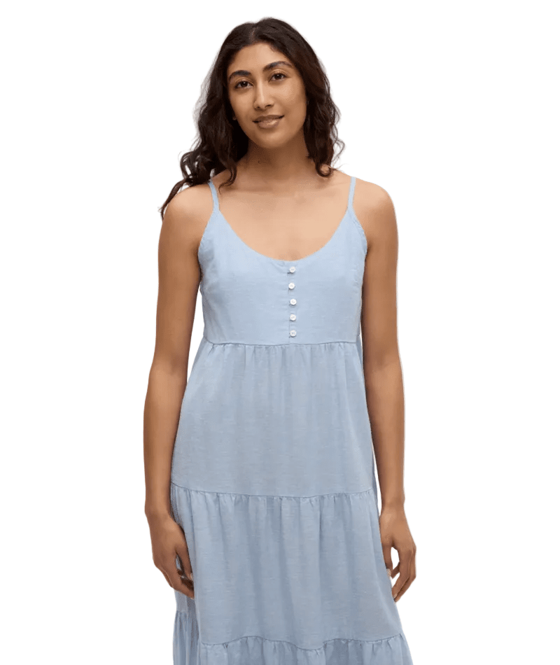 Light blue sleeveless dress with button front detail and tiered ruffled hem