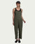 Olive green sleeveless jumpsuit with adjustable straps and front pockets on model