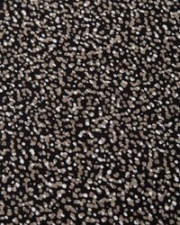 Black fabric with scattered white and beige polka dot pattern detail