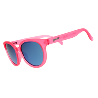 Round oversized pink translucent sunglasses with blue mirrored lenses, angled side view