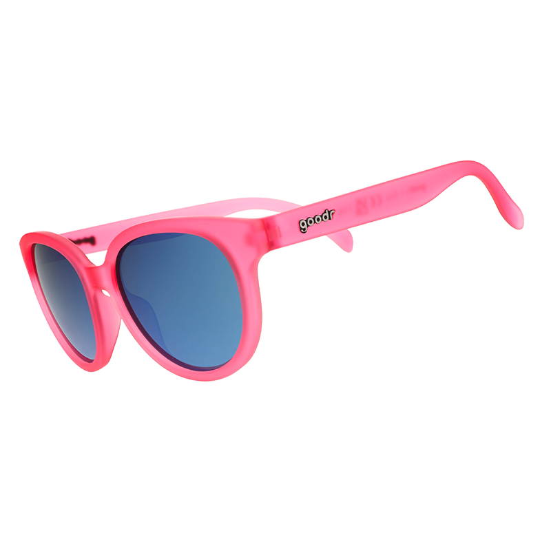 Round oversized pink translucent sunglasses with blue mirrored lenses, angled side view