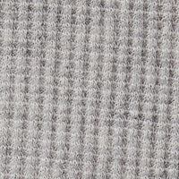 Close-up swatch of heather grey waffle-knit cotton fabric showing textured grid pattern