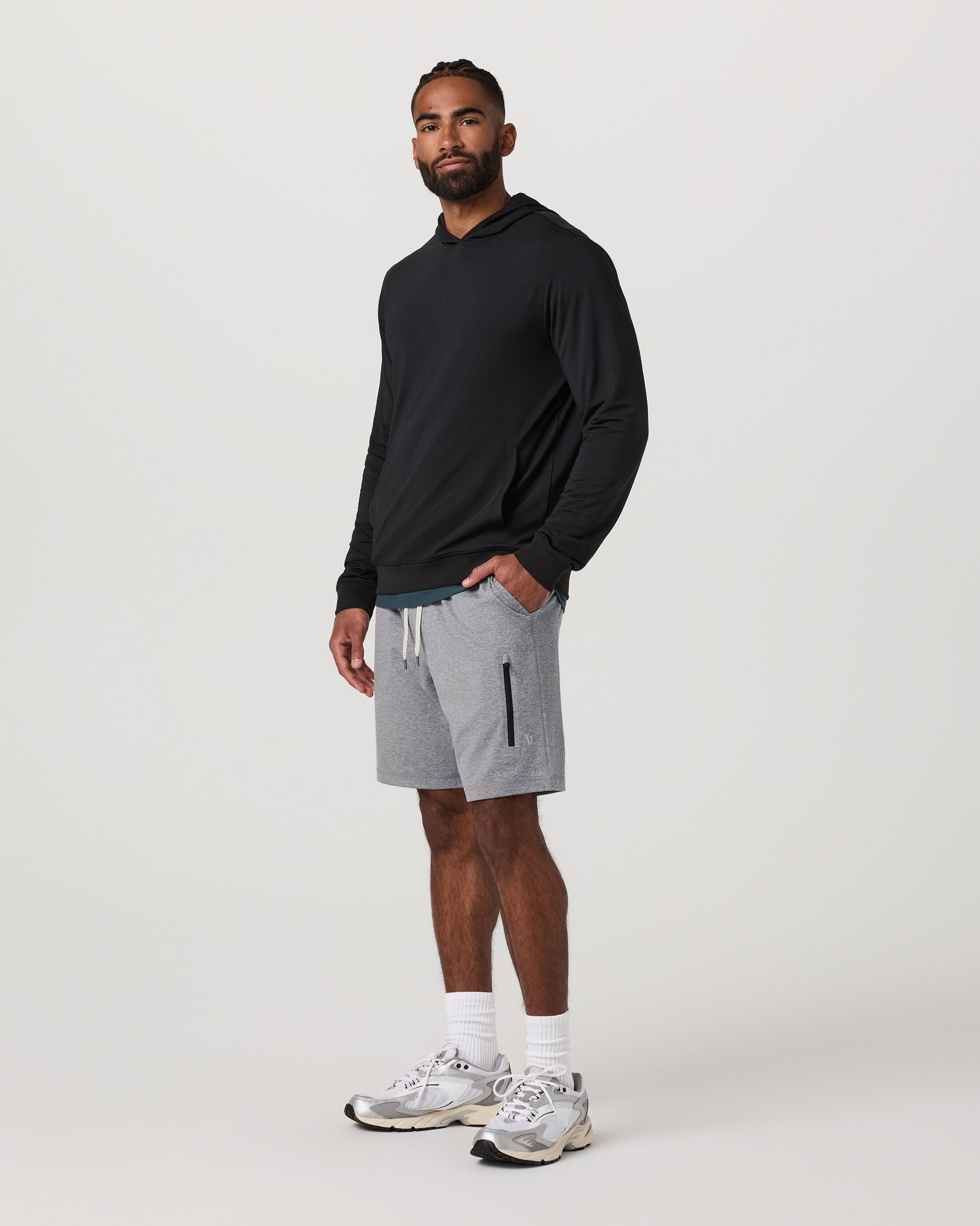 Men's grey heather athletic shorts with drawstring waist and zip pocket, full front view on model