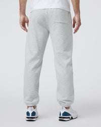 Men's grey fleece sweatpants with elastic cuffs and back pocket, rear view