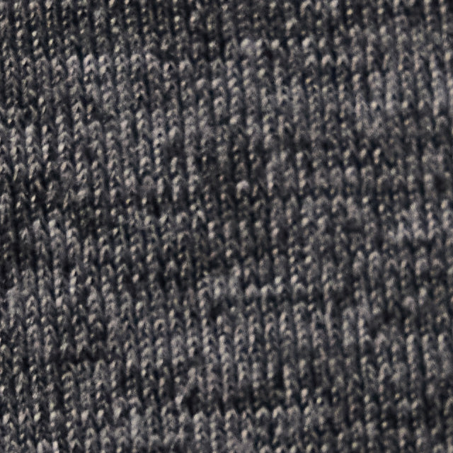 Close-up swatch of heathered dark gray knit fabric showing texture and weave detail