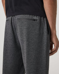 Back detail view of men's sweat shorts showing zipper pocket and elastic waistband