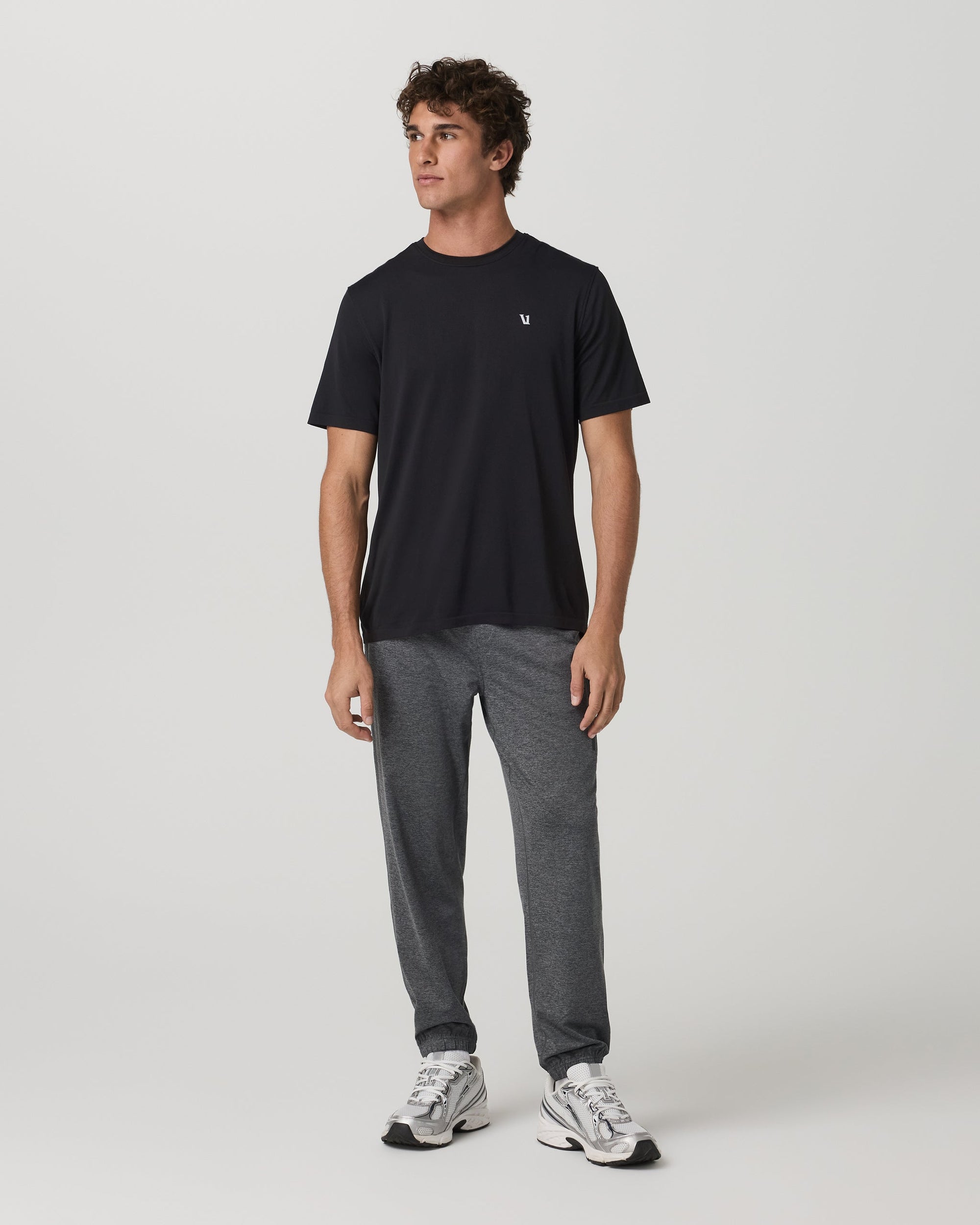 Men's heather gray jogger sweatpants with elastic cuffs, full front view on model