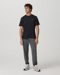 Men's heather gray jogger sweatpants with elastic cuffs, full front view on model