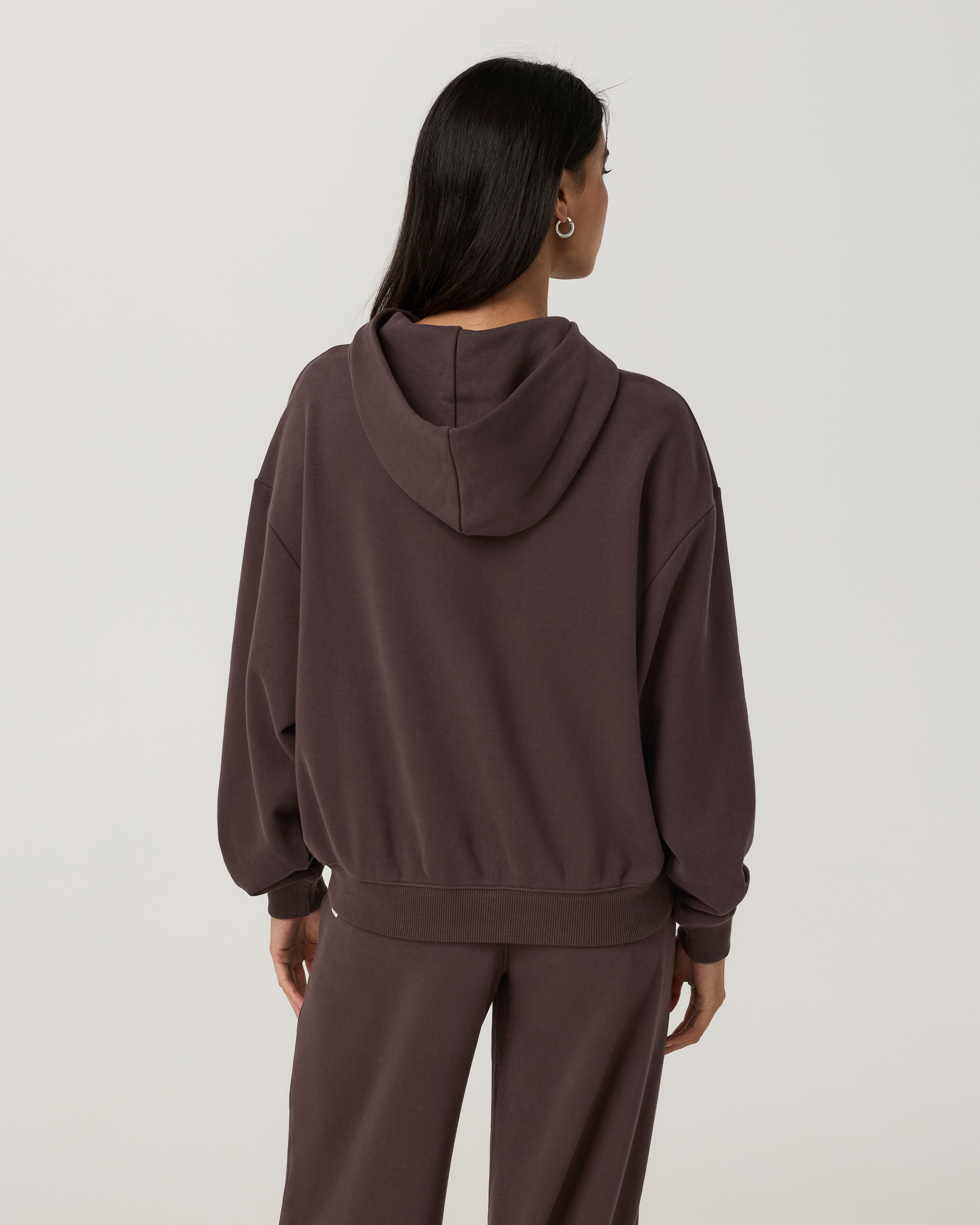 Women's pullover hoodie in dark brown, back view, oversized fit with matching sweatpants
