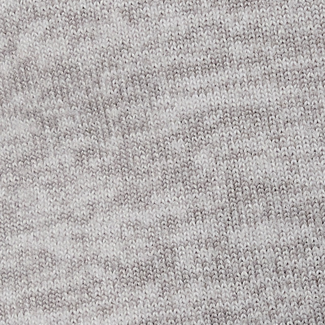 Close-up fabric swatch of heathered knit textile in light grey tones