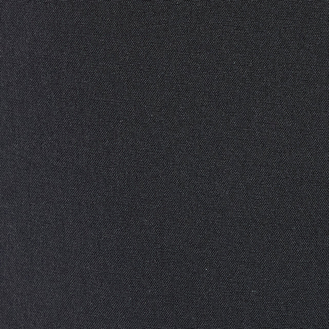 Close-up fabric swatch of dark black woven textile showing texture and weave detail