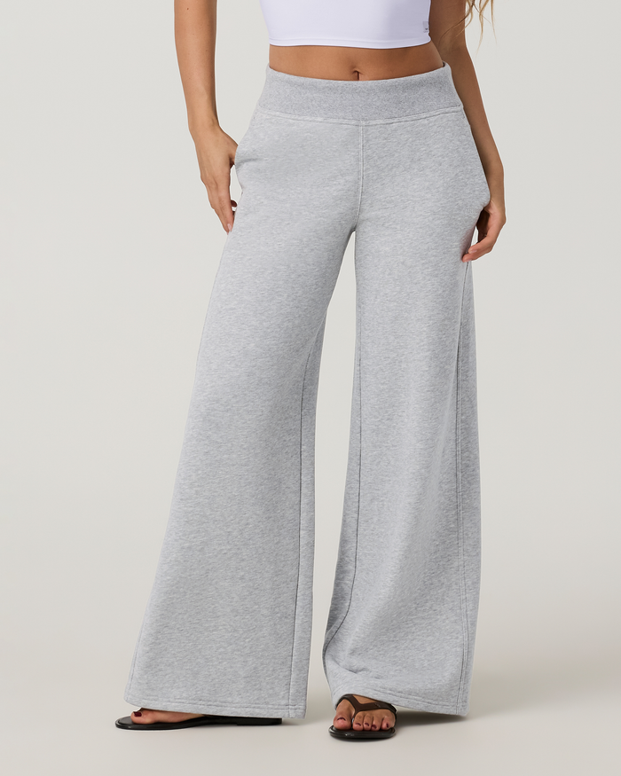 Women's wide-leg sweatpants in heather grey with high waistband, front view on model