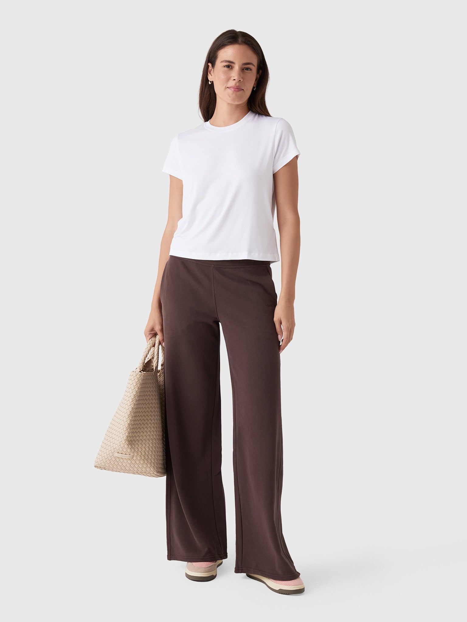 Dark brown wide-leg sweatpants with high waist, shown full-length on model with white tee