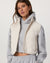 Women's cropped sherpa fleece vest with asymmetric zip, worn over gray hoodie, front view