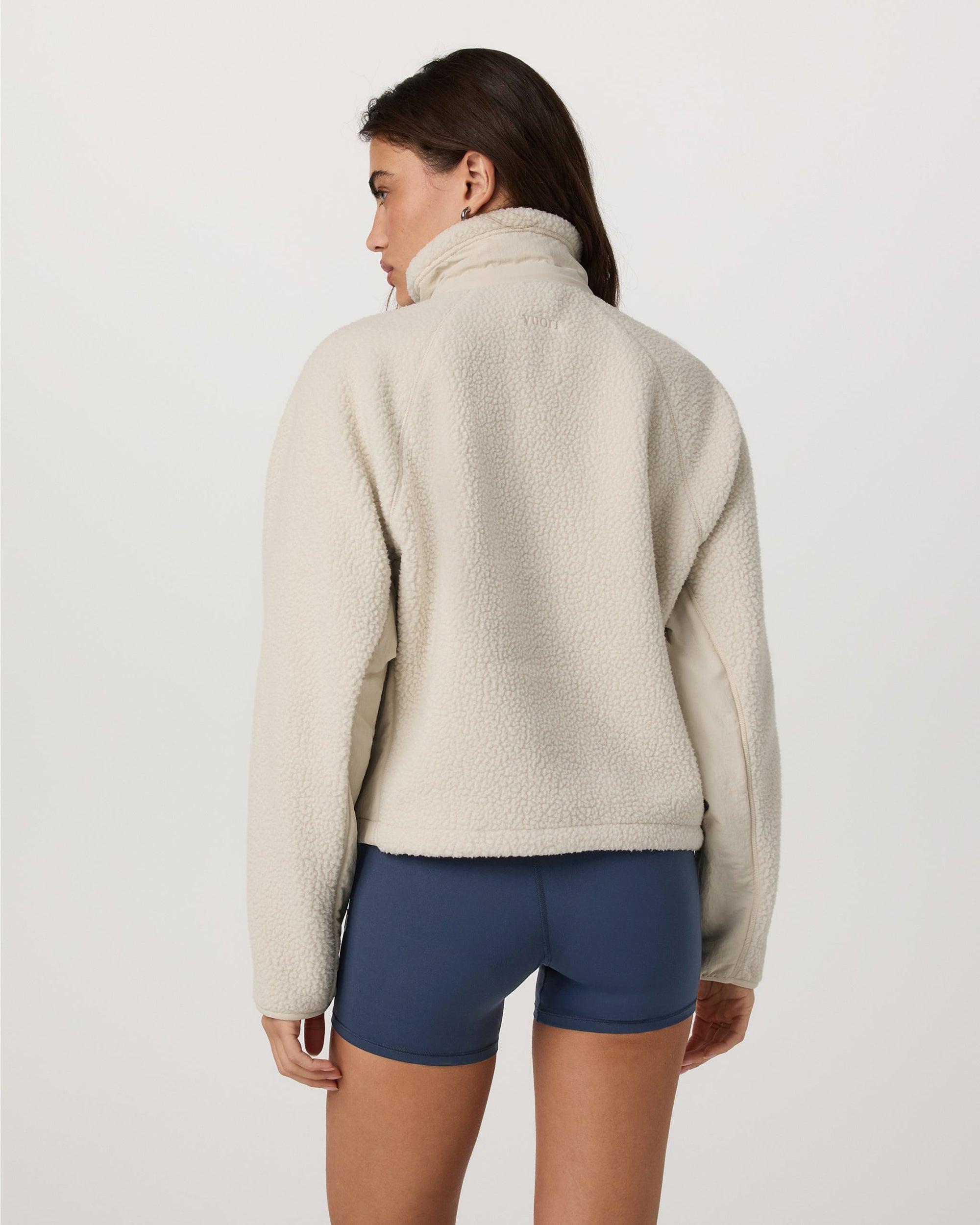 Women's sherpa fleece zip jacket in off-white, back view, with high collar