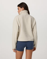 Women's sherpa fleece zip jacket in off-white, back view, with high collar
