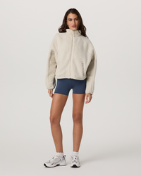 Women's sherpa fleece full-zip jacket in off-white, front view on model
