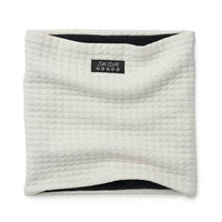Quilted neck warmer gaiter in off-white with black fleece lining, flat lay view