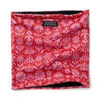 Red and pink floral patterned neck gaiter with black fleece lining, flat lay view