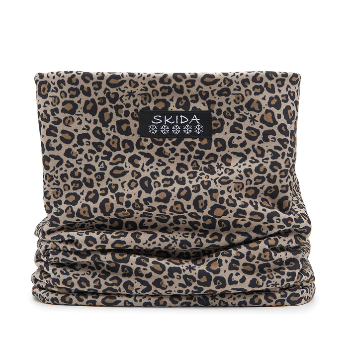 Leopard print neck gaiter tube scarf with black and tan pattern, flat lay view